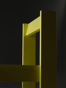 Backrest detail of yellow dining chair of the Foeppl Collection by Relvaokellermann for Holzrausch Editions.